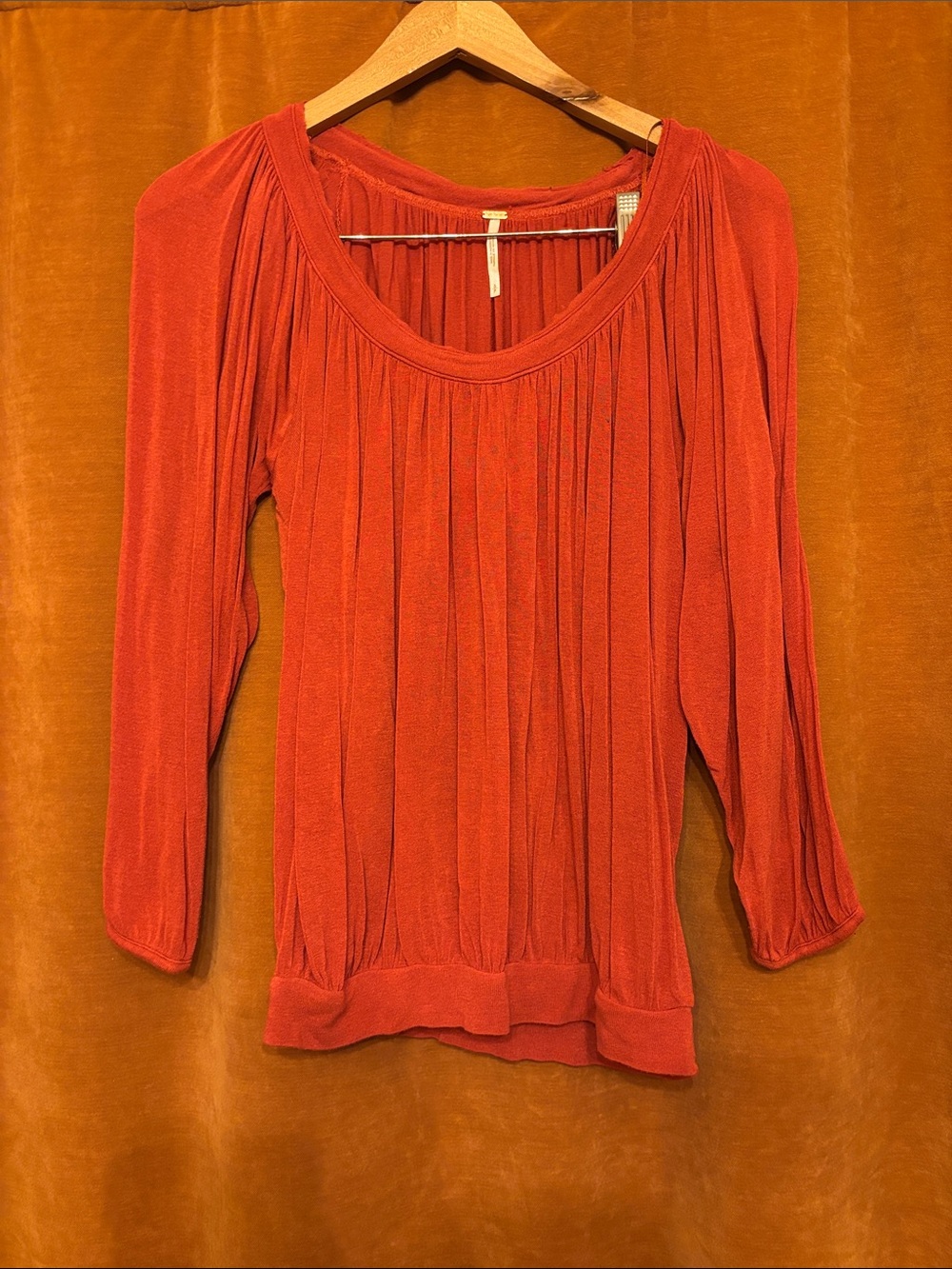 Free People Pleated Scoop-Neck Long Sleeve Top in Bright Orange